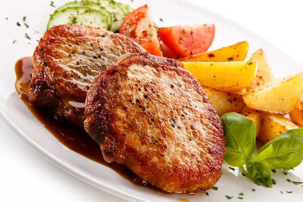 Roasted Pork Cutlets Potato Wedges Tomatoes Cucumbers Served White Plate — Stock Photo, Image