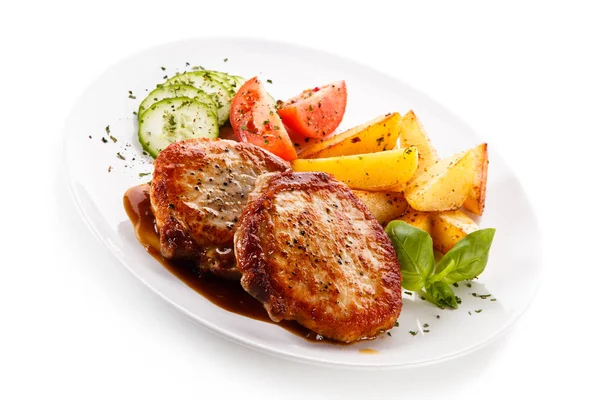 Roasted Pork Cutlets Potato Wedges Tomatoes Cucumbers Served White Plate — Stock Photo, Image