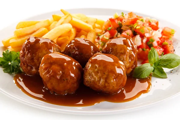 French Fries Meatballs Covered Tomato Sauce Served Plate Chopped Vegetables — Stock Photo, Image