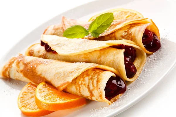 Twisted Crepes Cherries Served Sliced Orange Royalty Free Stock Photos