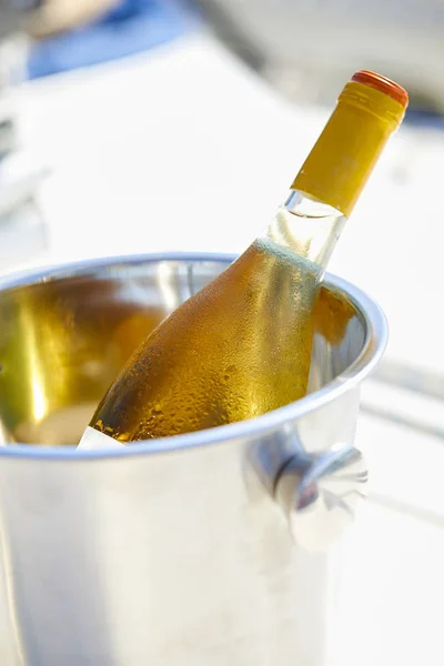 bucket with cold white wine bottle, close-up