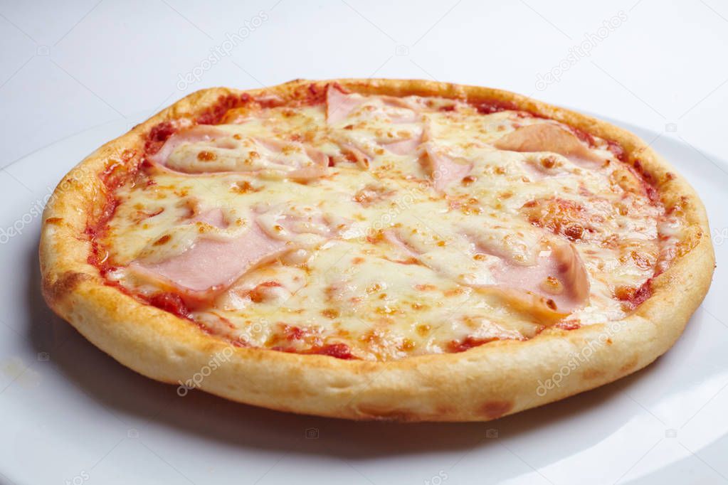 tasty pizza on white plate, close-up 