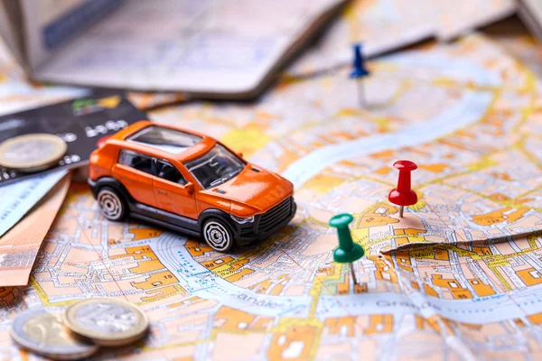 small toy car on map, travel concept