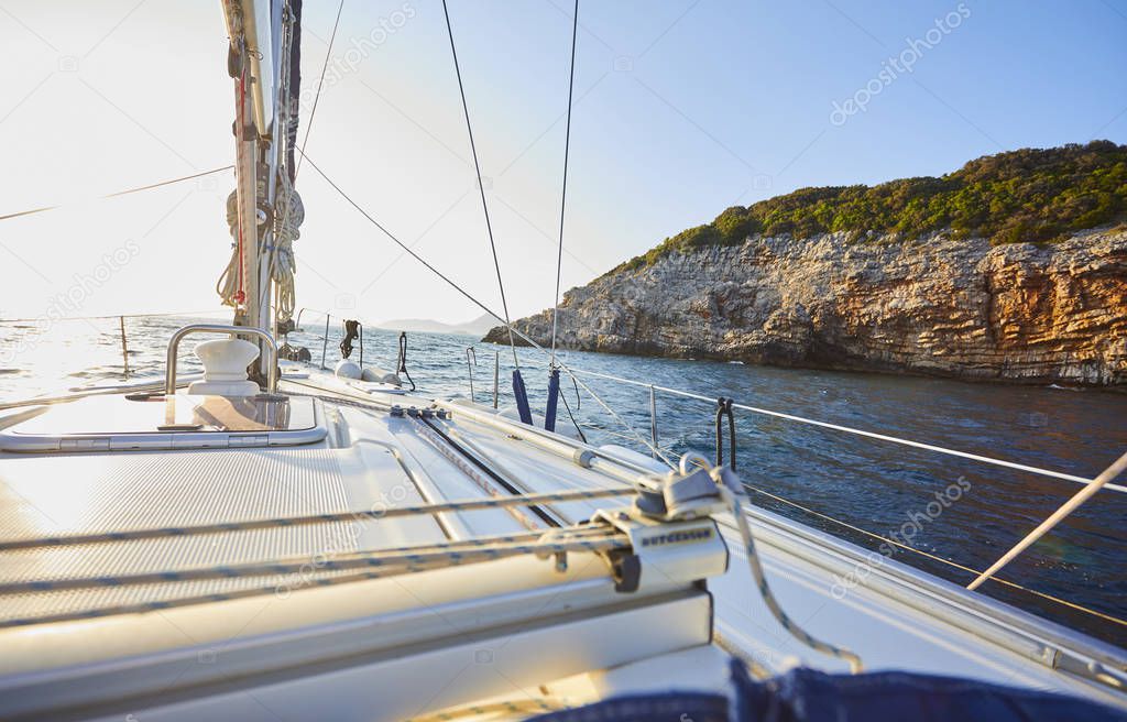 yacht floating in sea at sunny day