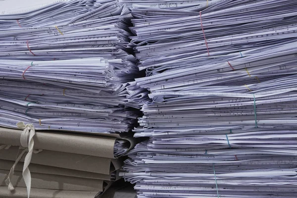 stacks of paper files in office, close-up