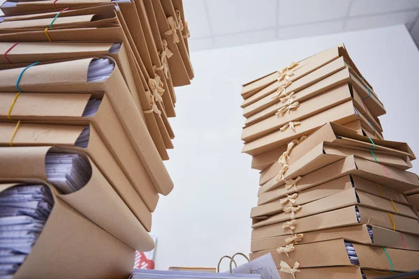 stacks of paper files in office, close-up