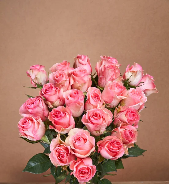 nice bouquet of flowers on beige background, close-up