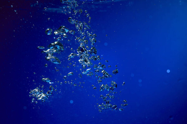 air bubbles in blue water, close-up 