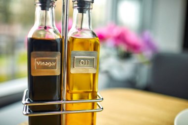 olive oil and balsamic vinegar in bottles on cafe table clipart