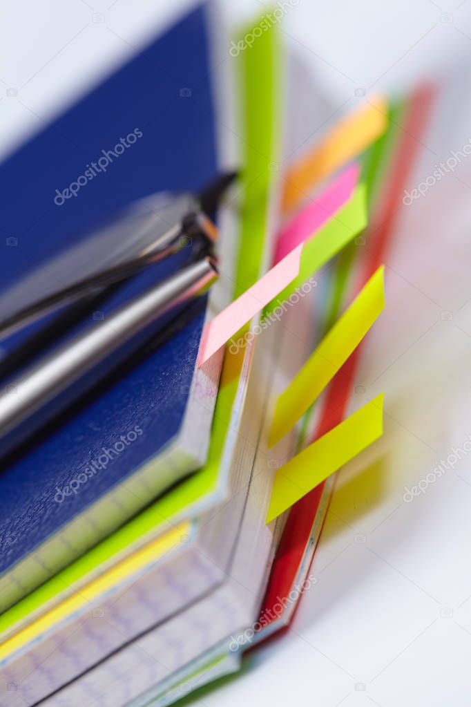 Business diary with colored tabs, close-up 