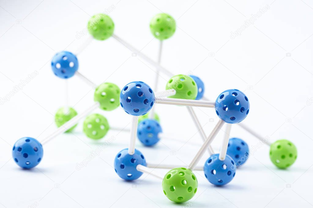 bright figure of molecular structure isolated on white background, close-up 