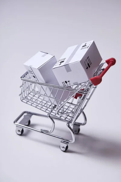 Shopping Trolley Boxes Isolated White Background Close — Stock Photo, Image