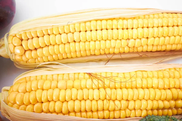 fresh corns isolated on white background, close-up