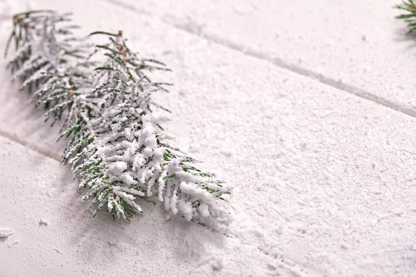 Snowed Christmas Tree Branches Wooden Background — Zdjęcie stockowe