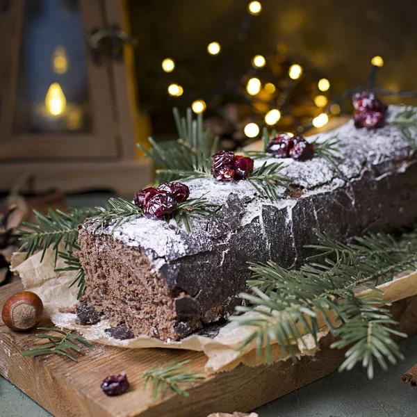 Chocolate swiss roll cake roulade with nuts