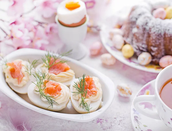 Easter breakfast.Cake and eggs with salmon — Stock Photo, Image