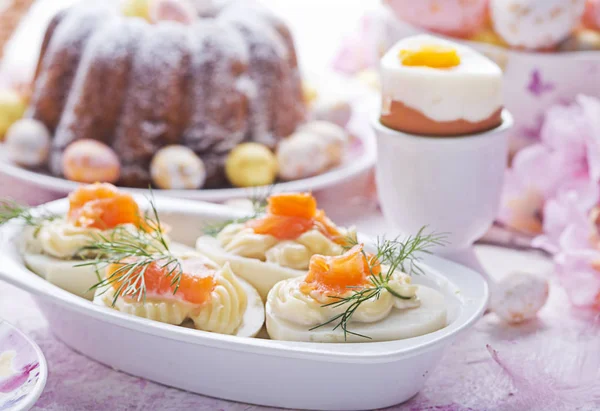 Easter breakfast.Cake and eggs with salmon — Stock Photo, Image
