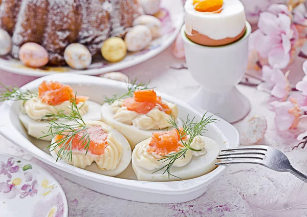 Easter breakfast.Cake and eggs with salmon — Stock Photo, Image