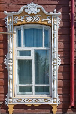 Fragment of the facade of an old wooden building, the former home of commoner Blinchevsky. Mariinsk, Kemerovo region clipart