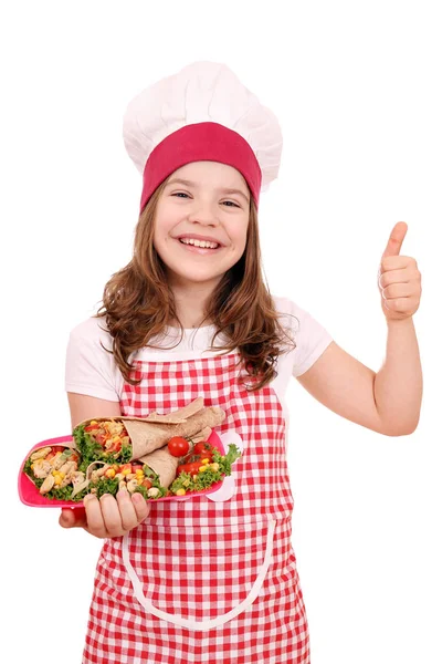 Felice bambina cuoca con burrito cibo messicano e pollice in su — Foto Stock