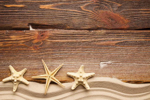 Hvězdice Pláž Písek Dřevěné Pozadí — Stock fotografie