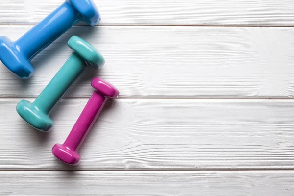 Colorful Dumbbells Wooden Background — Stock Photo, Image