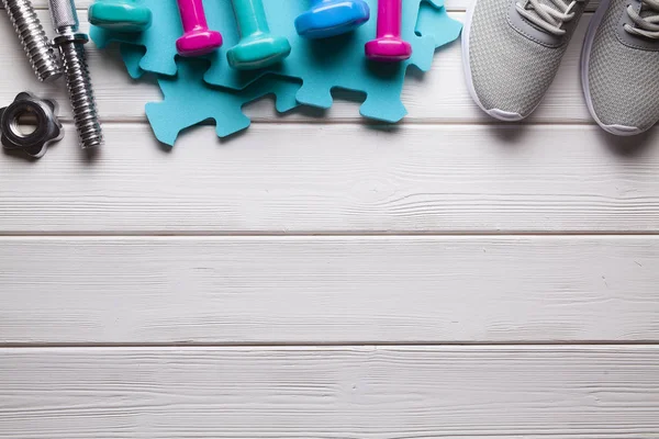 Sport Symbols Accessories Dumbbell Sneakers Wooden Background — Stock Photo, Image