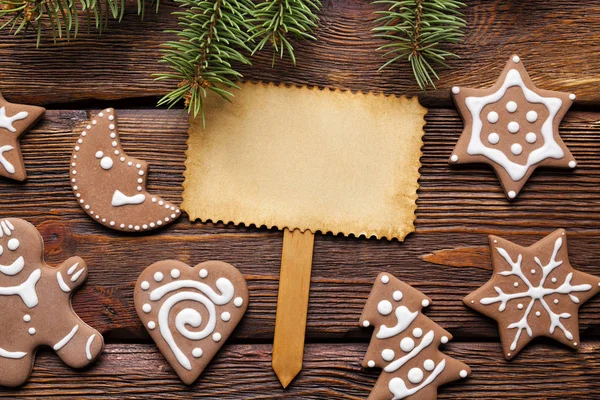 Prázdný Papír Kartu Perník Vánoční Cukroví Dřevěný Stůl — Stock fotografie