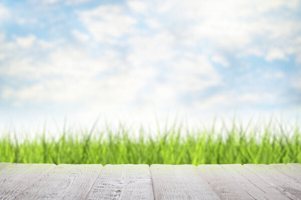 Wooden table with empty space on nature landscape background