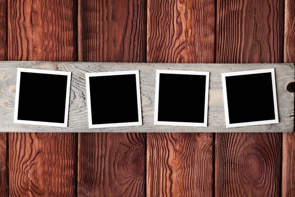 Classic photo frames on wooden board — Stock Photo, Image