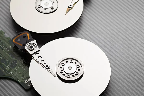 Hard disk drive on carbon fiber background — Stock Photo, Image