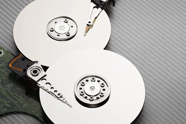 Hard disk drive on carbon fiber background — Stock Photo, Image