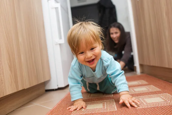 Mother and baby boy playing catch me if you can