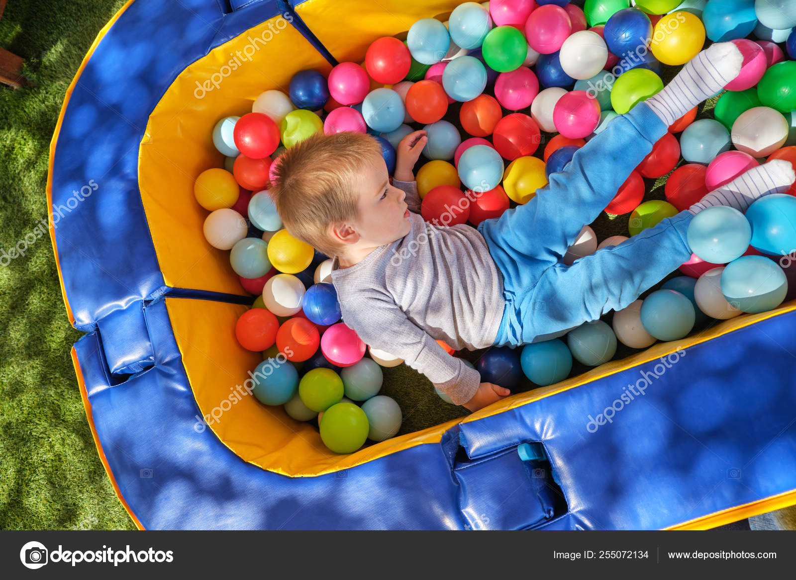 kid in ball pit