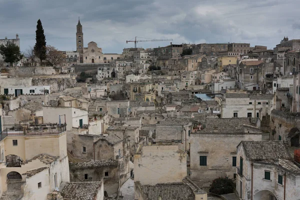 Italy, Southern Italy, Region of Basilicata, Province of Matera, Matera. The town lies in a small canyon carved out by the Gravina. Overview of town.