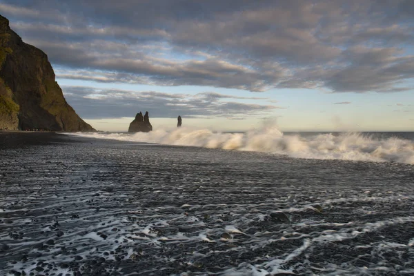 Reynisfjara or better known as Black Sand beach view during sunrise