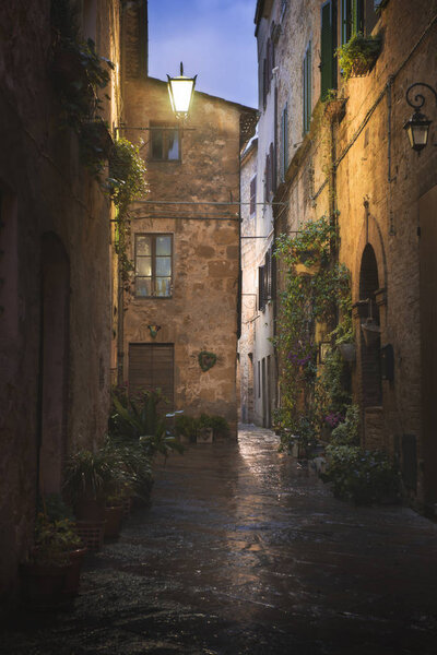 Beautiful street of tuscan Pienza town by night