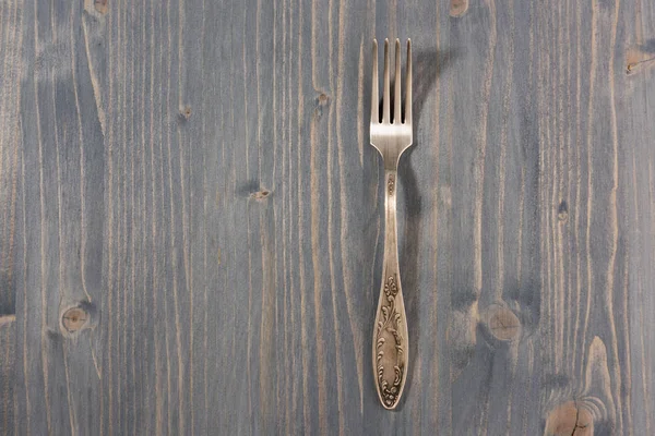 Old cutlery. Top view On a wooden background, Copy space.