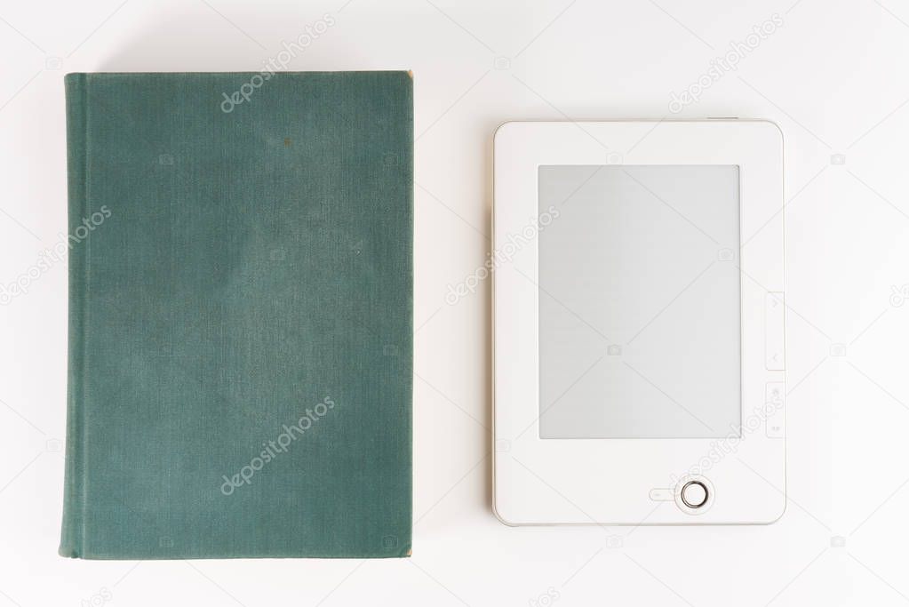 Digital e-book reader with a blank screen with old paper book isolated on white background