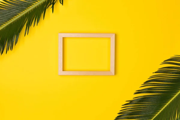 Minimalist Summer Flat Lay Photo Frame Palm Leaves Yellow Backgroun — Stock Photo, Image