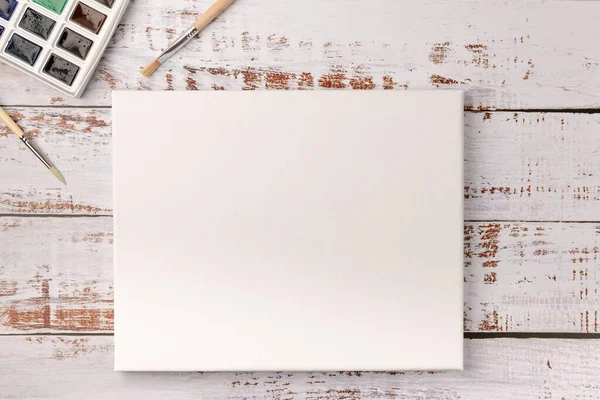 Pinturas Acuarela Pinceles Lienzo Blanco Sobre Fondo Madera Copiar Espacio —  Fotos de Stock