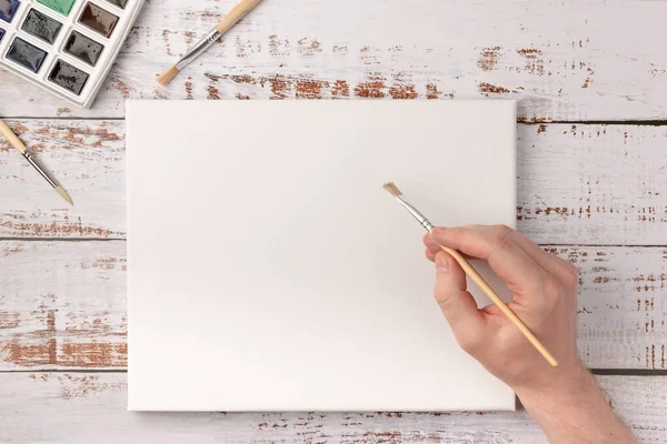 Aquarellfarben Pinsel Weiße Leinwand Auf Holzschreibtisch Handzeichnung Auf Weißer Leinwand — Stockfoto