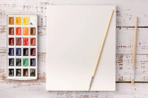Akvarelové Barvy Štětce Bílé Plátno Dřevěném Pozadí Rozumím Horní Pohled Royalty Free Stock Obrázky