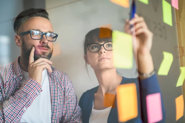 Business people meeting at office and use post it notes to share ideas