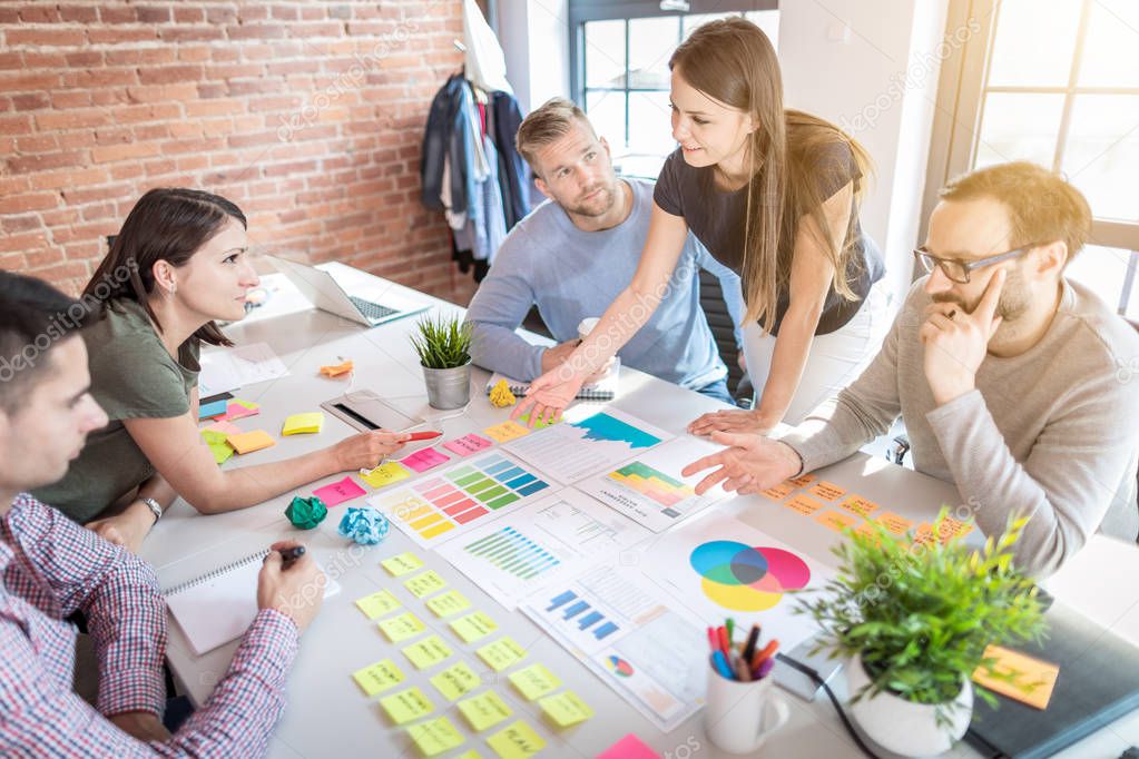 young business people working on design at office desk