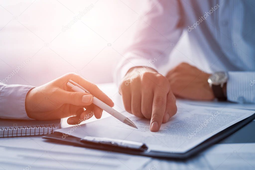 Business people hands with paper contract
