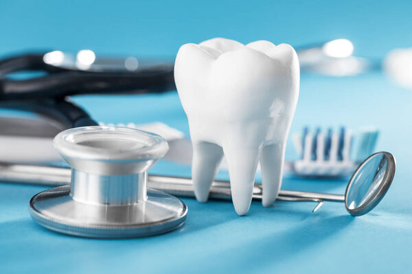 White healthy tooth, different tools for dental care