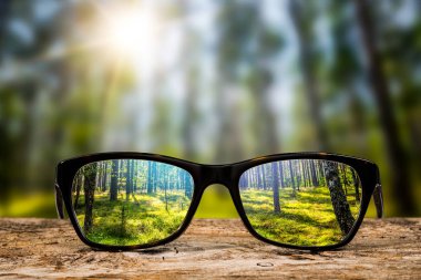 glasses focus background wooden eye vision lens eyeglasses nature reflection look looking through see clear sight concept transparent sunrise prescription sunset vintage sunny sun retro - stock image clipart