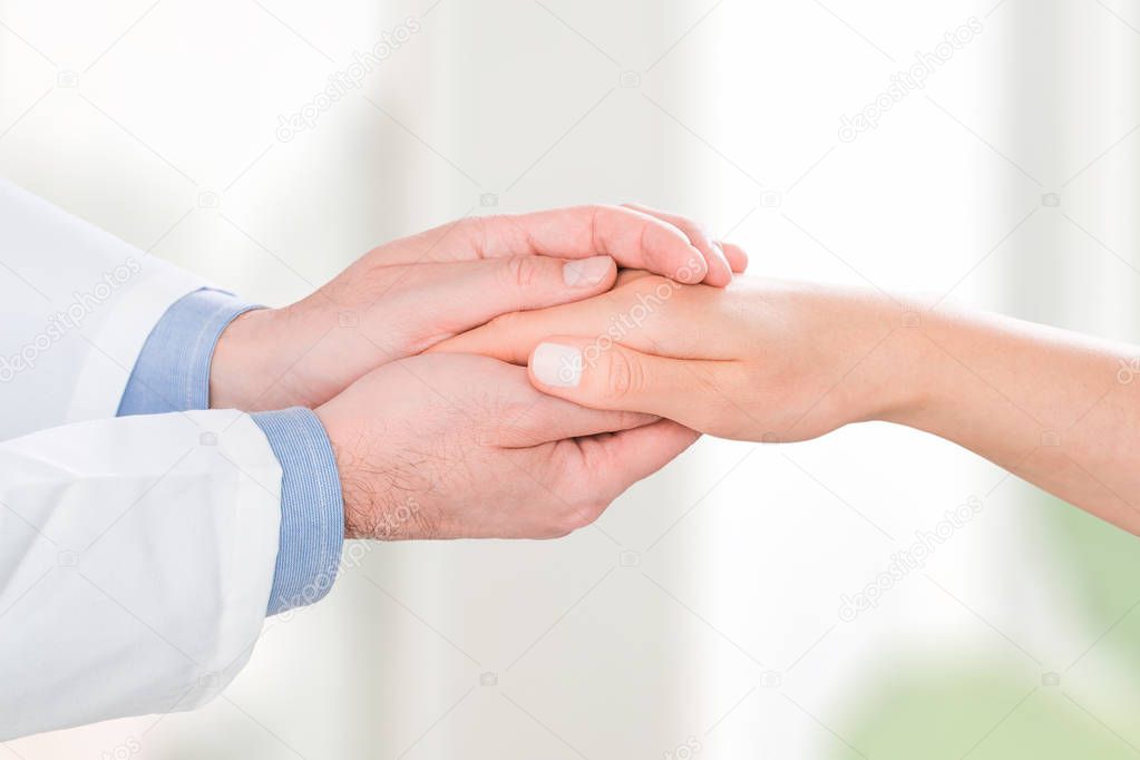 doctor patient care holding human hand trust touch medical thanks help clinic health concept - stock image