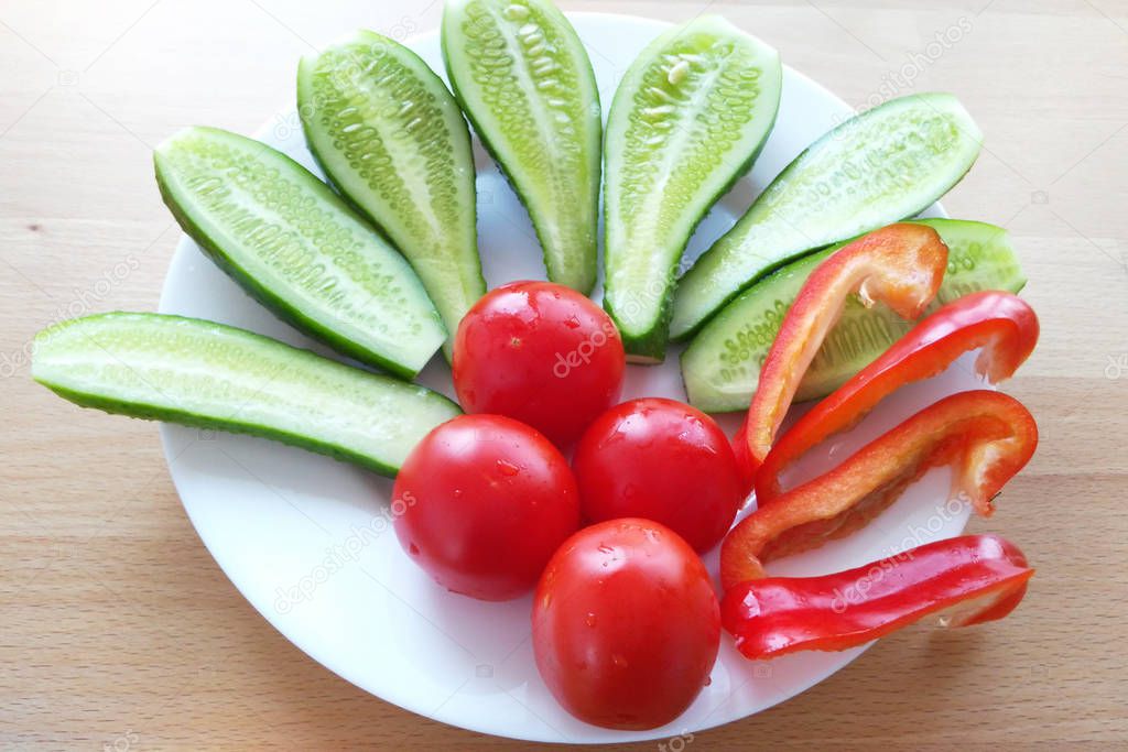  seasonal vegetables lie on a white plate